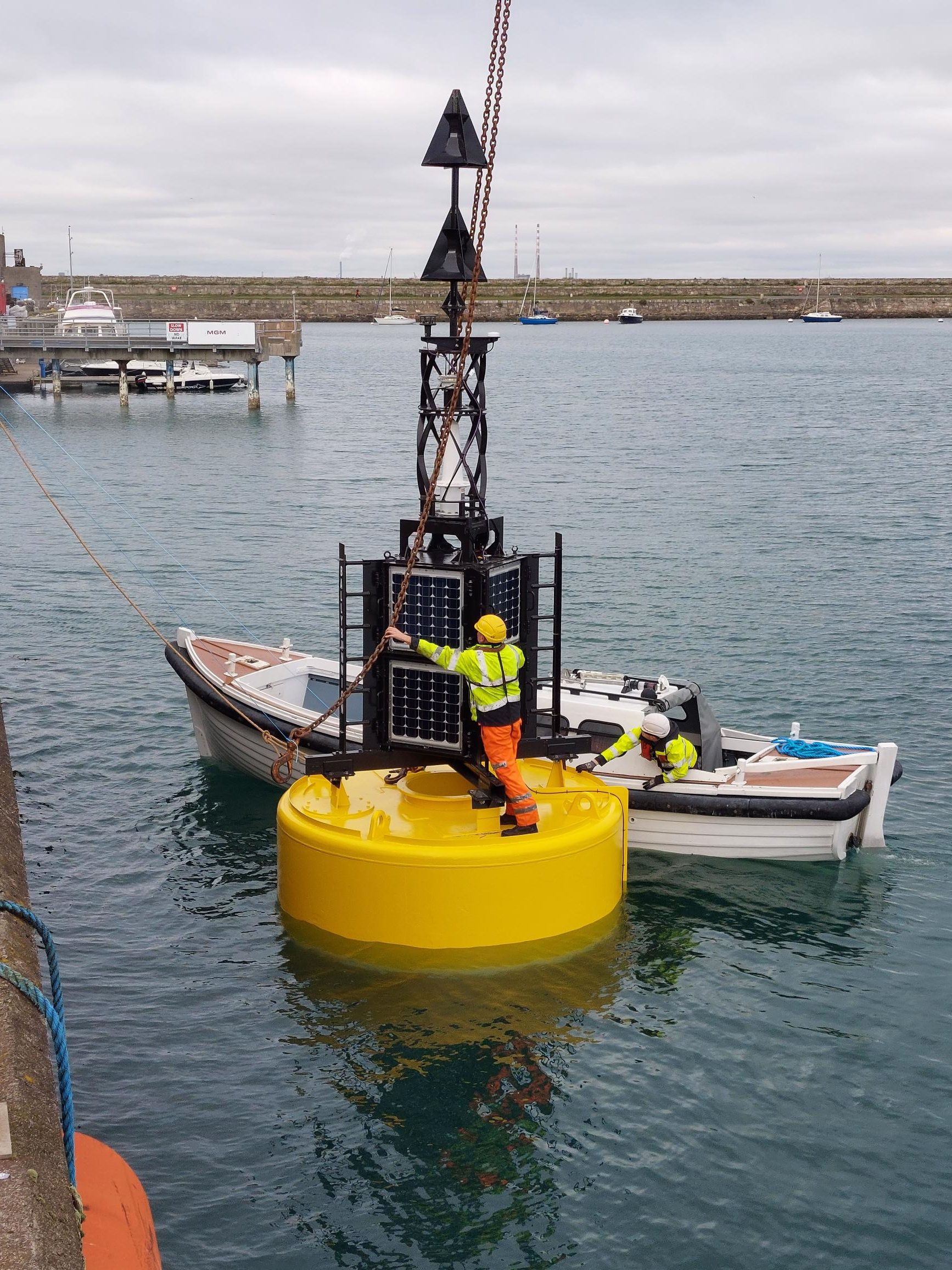 Ballybunnion Buoy being unhooked from crane at Dun Laoghaire, ready to be towed to Irish Lights ship ILV Granuaile