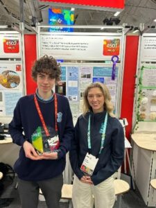 Nicolas __ from Malahide Community School, winner of the Met Éireann Award at Stripe Young Scientist and Technology Exhibition, alongside Met Éireann meteorologist, Holly O'Neill