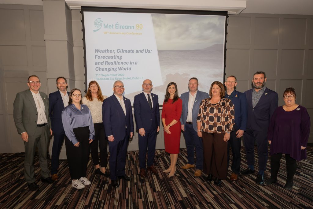 Met Éireann 90th anniversary conference speakers and panellists group photograph in the conference room.